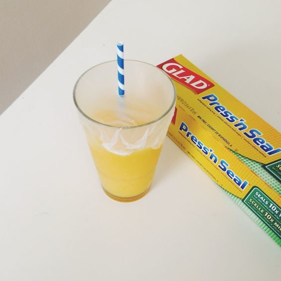 Make a makeshift travel cup for the kids with some Press'n Seal wrap.