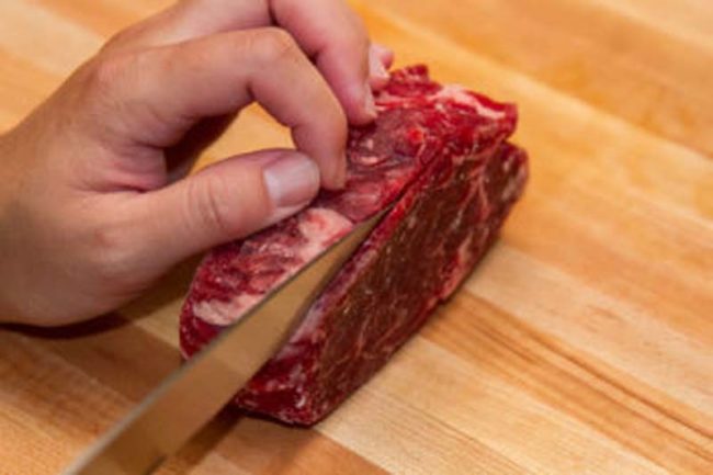 If you want to cut meat into thin slices, freeze it for 1-2 hours before you cut it.