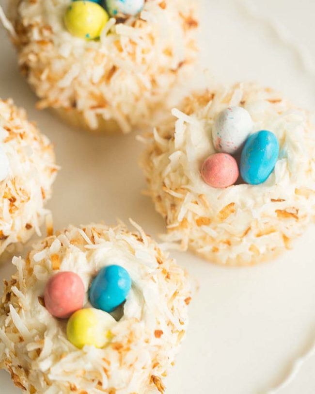 Create coconut "nest" cupcakes with candy eggs.