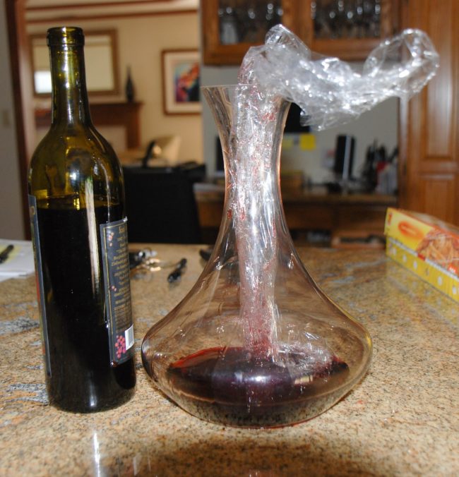 De-cork a bottle of wine by swirling it around with some Saran Wrap. Remove the film and it'll taste just fine!