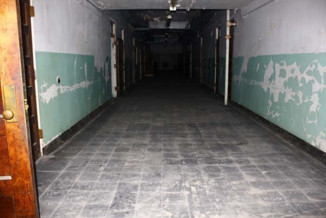 DocIsIn and a few friends decided to make a night out of exploring the old Trans-Allegheny Lunatic Asylum in West Virginia. One of the many photos they took was of this ordinary-looking hallway.