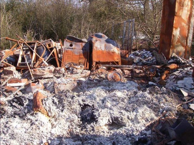 All that was left of Creeky's house was this pile of rubble and ash. It wouldn't surprise me in the least if there were some human remains in there somewhere.