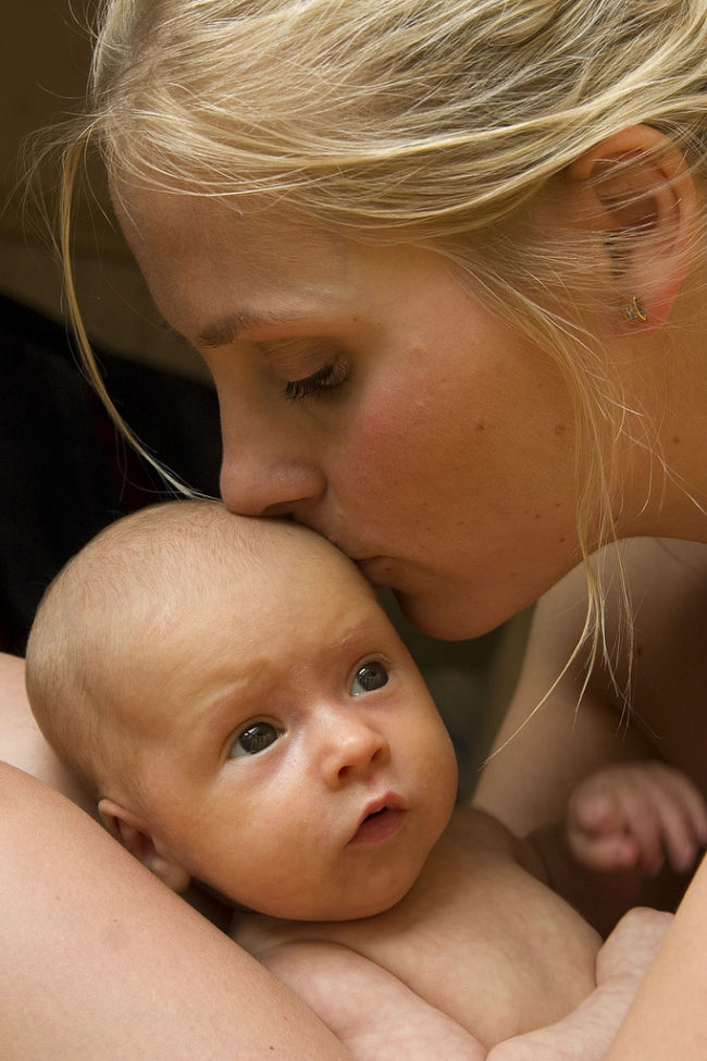 A mother feels compelled to <a href="http://tibstt.org/tibs/why-mothers-kiss-their-babies/" target="_blank">kiss her baby</a> because she will ingest any bacteria/viruses on the baby&rsquo;s skin, thus creating antibodies that go into her breast milk. They will protect the baby from possible infection.