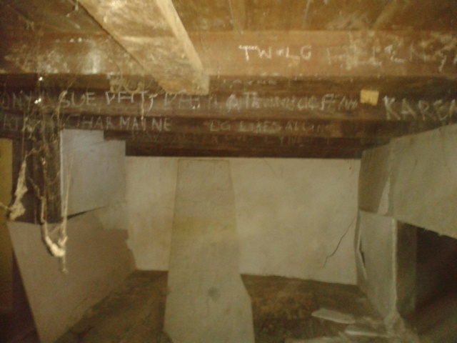 A few days later, the pit had been boarded up, cobwebs were disturbed, and there were drag-marks in the dirt. Creepily enough, they found new names etched on the support beams...