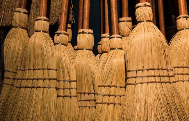 Clean wicker furniture, old brooms, or other natural fibers by scrubbing them with a stiff brush soaked in a solution of half a cup of salt and one gallon of warm water.
