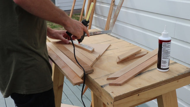 After cutting the design up into pieces, he glued on the scrap wood.