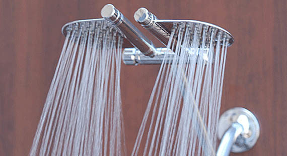 If one showerhead isn't enough, just shower separately.