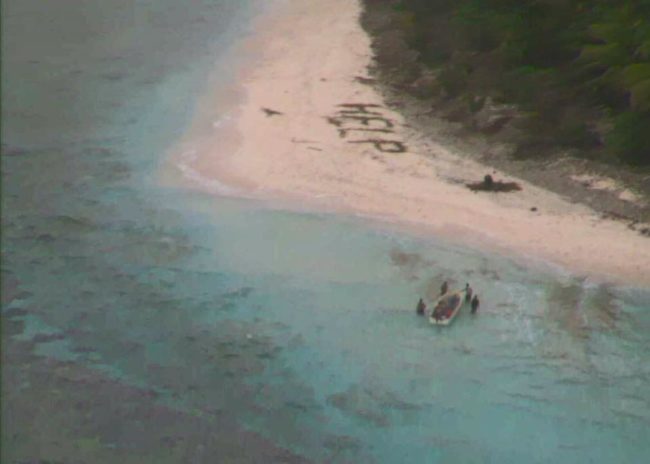 Channeling every search-and-rescue movie in the history of forever, they spelled out "HELP" in the sand and started flailing their arms at the sky.