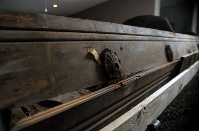 Because of the state of the original coffin, Oswald's remains were reburied in a new one. His family just assumed that the older one was destroyed immediately thereafter.