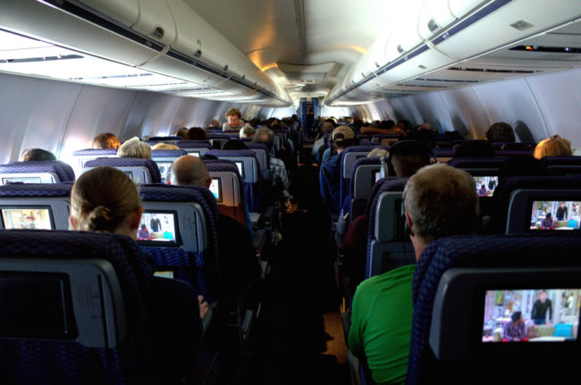 When he got off his call, a flight attendant came over and walked him off the plane.