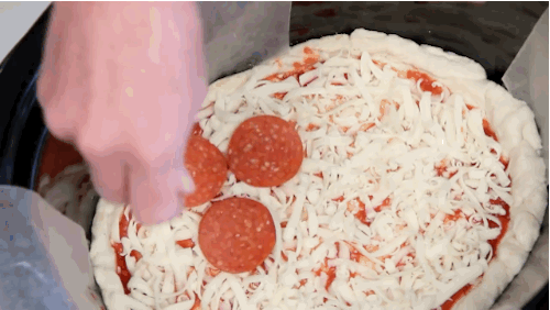 Add some pepperoni -- or whatever topping you prefer -- and that's it! Cook it on high for one and a half hours, and you'll have a delicious homemade pizza waiting for you.