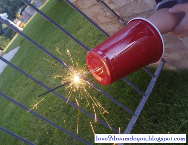 Make a DIY sparkler hand protector out of a Solo cup.