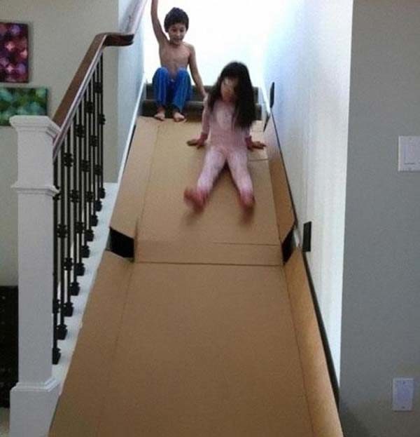 A large cardboard box can turn any stairway into a slide.