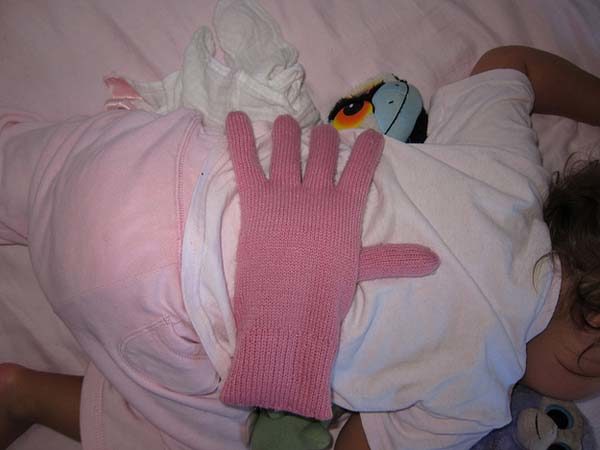 Fill a glove with beans to make it seem like you are holding your little one while they sleep.