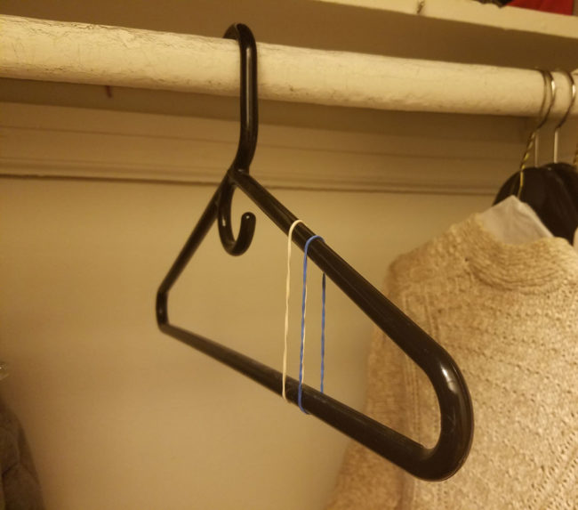 Hate when your clothes slip off the hangers? Put a few rubber bands on them and they'll never budge.
