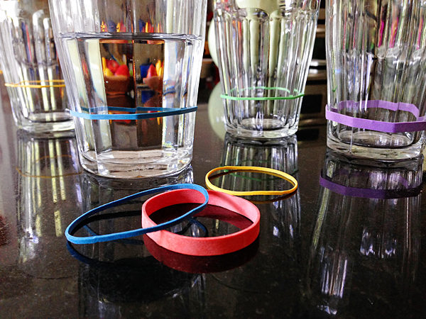 Tell everyone's glass apart at a party with colorful rubber bands.