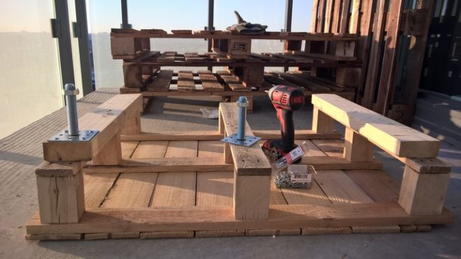 First, he wanted a table. All he did was add two-by-fours to each side (for added height) and drill some legs on.