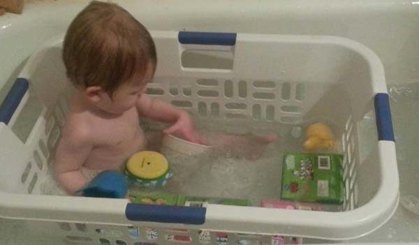 Prevent your kid's toys from floating away in the tub with an old laundry basket.