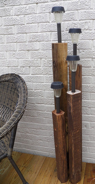 Use a block of wood and some solar lights for beautifully simple lighting.