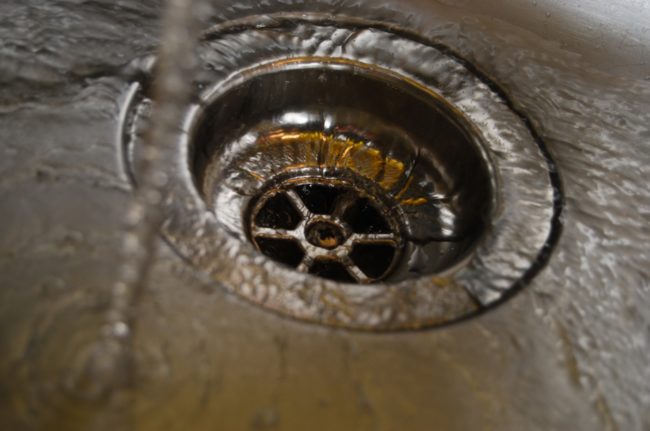 You can clean a clogged drain easily if you pour a cup of salt, half a cup of white vinegar, and one cup of baking soda down the drain. Wait ten minutes, pour a half gallon of boiling water down the drain, and it should be unclogged!