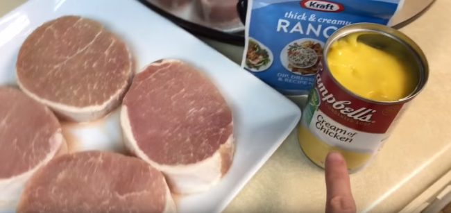 All you need for this recipe is 3 or 4 pork chops, a can of cream of chicken soup, and a packet of dry ranch dressing mix.