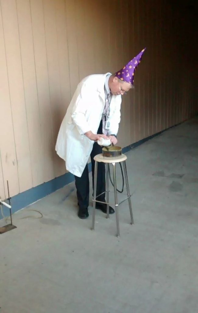 When this science teacher conducts experiments, he wears a sweet hat.