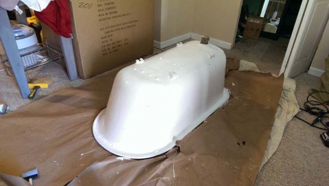 Once the primer dried, they painted the tub with Rustoleum Appliance Paint (enamel finish, dries hard).