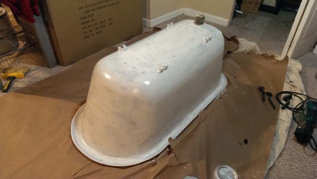 Then, they covered the tub's underside with Rustoleum Metal Primer Paint.