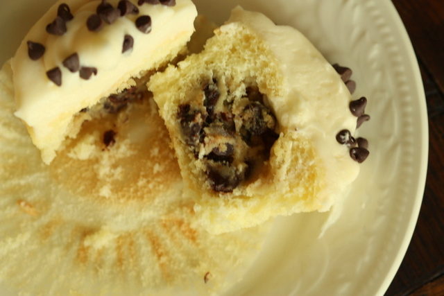 When your guests (or, y'know...you) bite into these <a href="http://half-bakedbaker.blogspot.com/2012/09/chocolate-chip-cookie-dough-cupcakes.html" target="_blank">seemingly normal cupcakes</a>, they'll be met with the best cookie dough surprise.