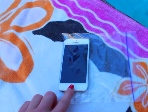 <a href="https://funnymodo.com/summer-beach-hacks/" target="_blank">Protect your phone</a> from water and sand this summer by using it through a plastic bag.