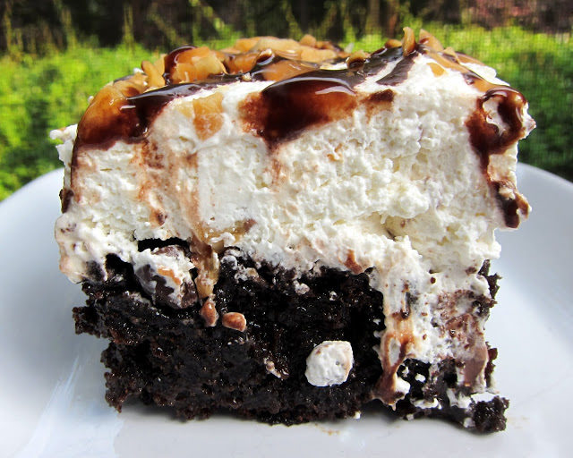 Finally, someone turned <a href="http://www.plainchicken.com/2012/05/snickers-cake.html" target="_blank">Snickers into a poke cake</a>!