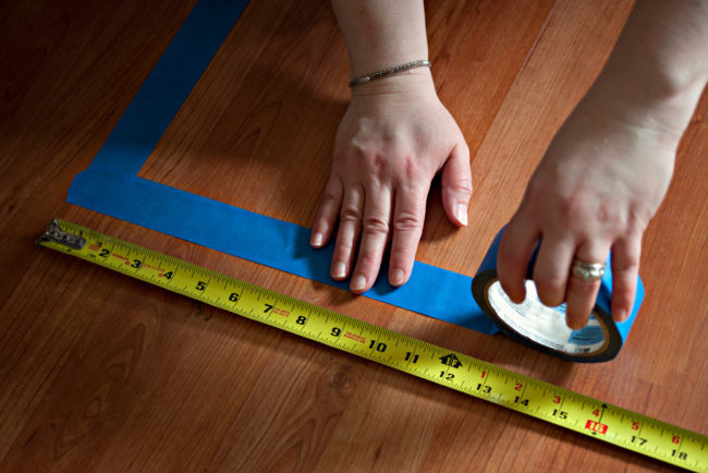 Get rid of tape residue on your hardwood floors with a mix of two tablespoons of baking soda and a quarter to a half teaspoon of water.