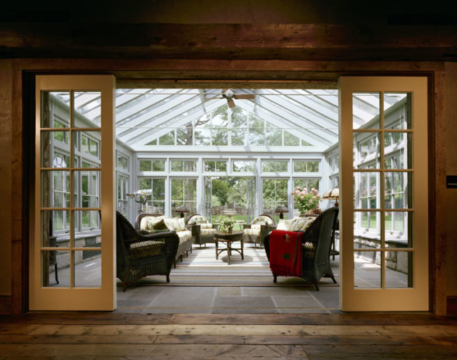 The connecting glassed-in conservatory is a beautifully elegant addition.