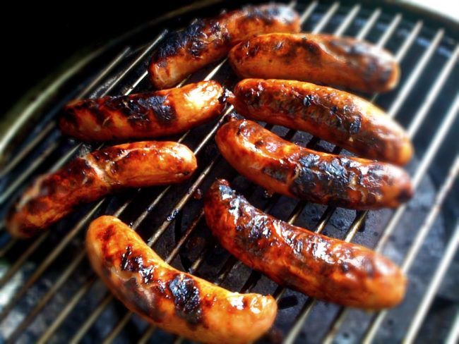 Poach sausages for a few minutes to ensure that they stay tender and develop a char of epic proportions when it's time to grill.