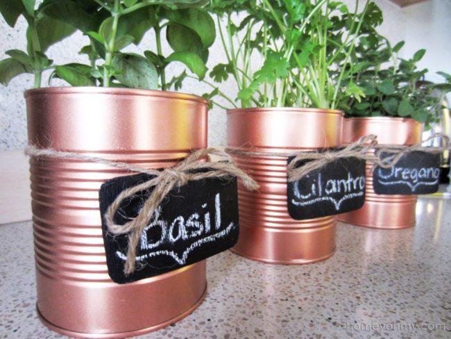 Believe it or not, but <a href="http://www.homeyohmy.com/diy-copper-tin-can-planters-chalkboard-tags/" target="_blank">these</a> were once ugly tin cans. Copper paint to the rescue!