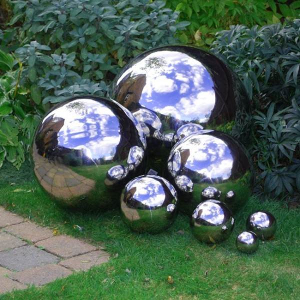Use some <a href="http://www.thegardenglove.com/how-to-make-mirrored-gazing-balls-for-the-garden/" target="_blank">chrome metallic spray paint</a> to make bowling balls into reflective garden orbs.