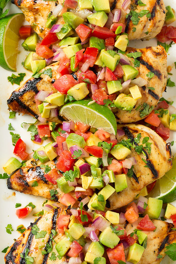 Everyone likes grilled chicken, but this <a href="http://www.cookingclassy.com/2015/07/grilled-cilantro-lime-chicken-with-avocado-salsa/" target="_blank">recipe with avocado salsa</a> will make guests fall in love. (Because avocado.)