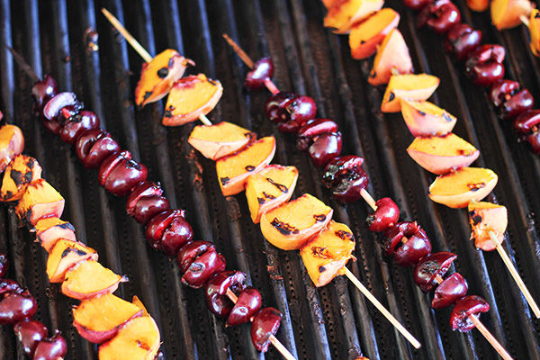 When you're done grilling these <a href="http://homecookingmemories.com/grilled-peaches-and-cherries-cinnamon-honey-syrup/" target="_blank">peaches and cherries</a>, they get a cinnamon honey syrup. YES.