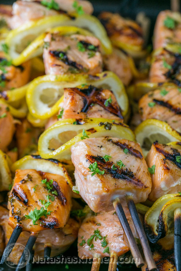 These garlic and dijon <a href="http://natashaskitchen.com/2015/06/12/grilled-salmon-skewers-with-garlic-and-dijon/" target="_blank">salmon skewers</a> come with their own lemons!