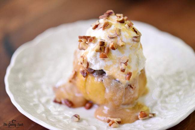 This <a href="http://www.thegunnysack.com/bloomin-grilled-apples/" target="_blank">grilled apple</a> is filled with maple cream caramel sauce and topped with ice cream.