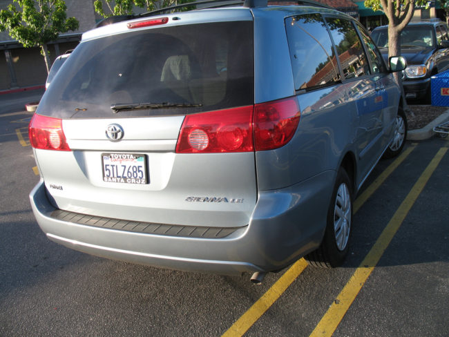 Put a sheet down in the back of your car and place all your beach gear on it.