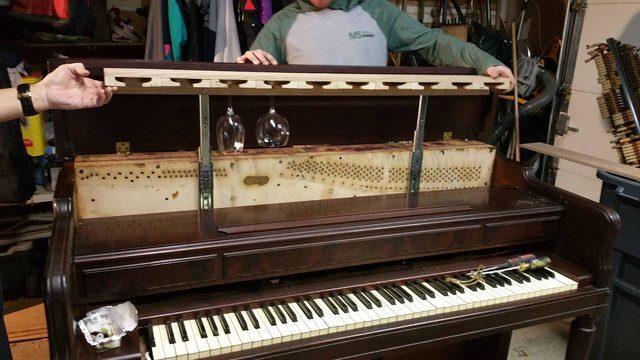 He then installed some hardware to turn the glass rack into a retractable drawer.