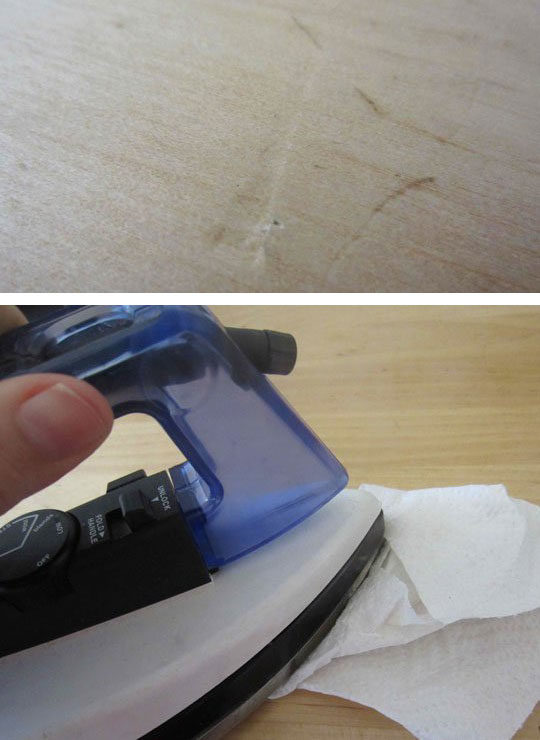 Get rid of dents by wetting the spot and dampening a cloth or paper towel. Rub and iron over the cloth on the spot in a circular motion, checking after a minute or two on the progress.