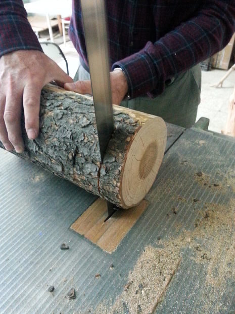 First, he cut the log with a bandsaw. Each piece was the same thickness, coming in at around 0.75 inches.