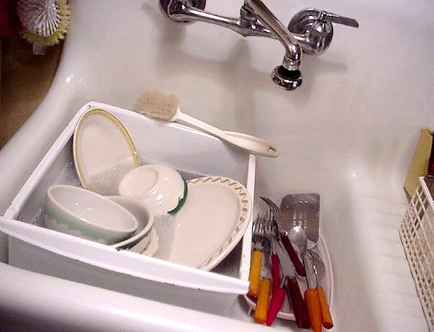 Instead of soaking your dishes in the sink, suds them up in a plastic bin outside the sink so that area is free for other dish-washing duties.