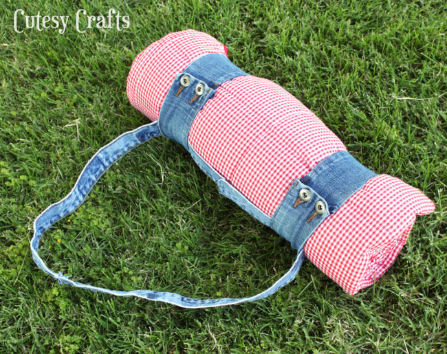 Not only is this picnic blanket made with old jean pieces, the carrying sash uses denim, too!