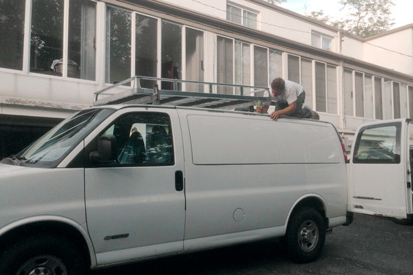 Outside, zachboth outfitted the van with a Hummer's roof rack.