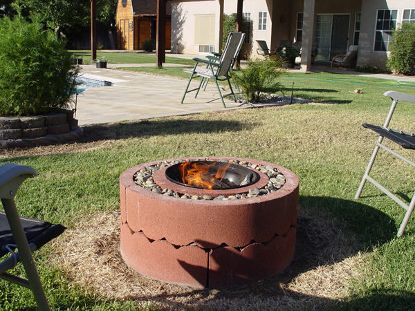 All it took was $50 to make this pit out of concrete tree rings and an old grill.