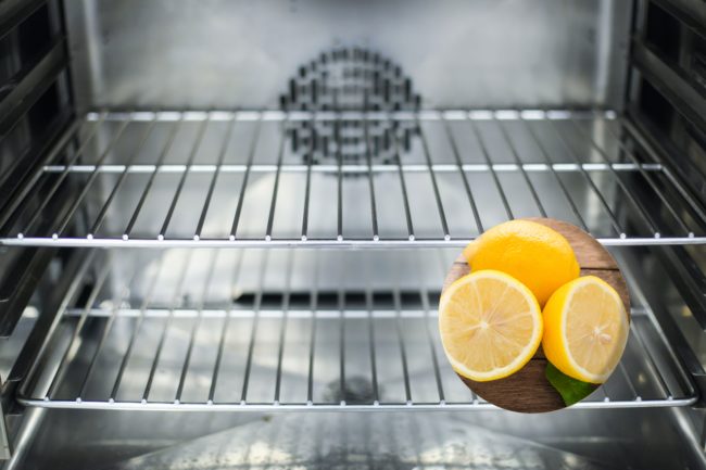 Slice each lemon in half and place the halves directly on the rack.