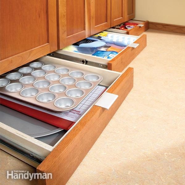 Create the least clunky kitchen storage of all time by building <a href="http://www.familyhandyman.com/kitchen/storage/how-to-build-under-cabinet-drawers-increase-kitchen-storage/view-all" target="_blank">baseboard drawers</a>.